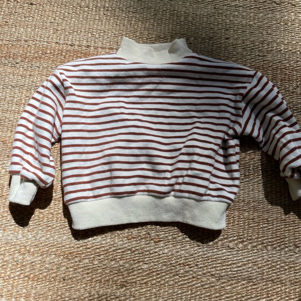 Retro turtleneck cream sweatshirt with rust colored stripes